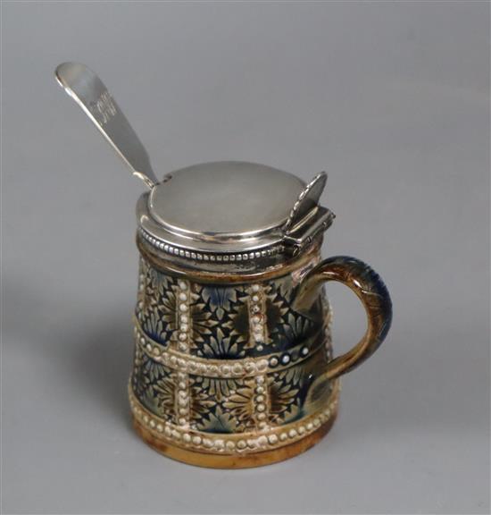 A Royal Doulton mustard pot with silver top complete with a silver serving spoon H.8cm